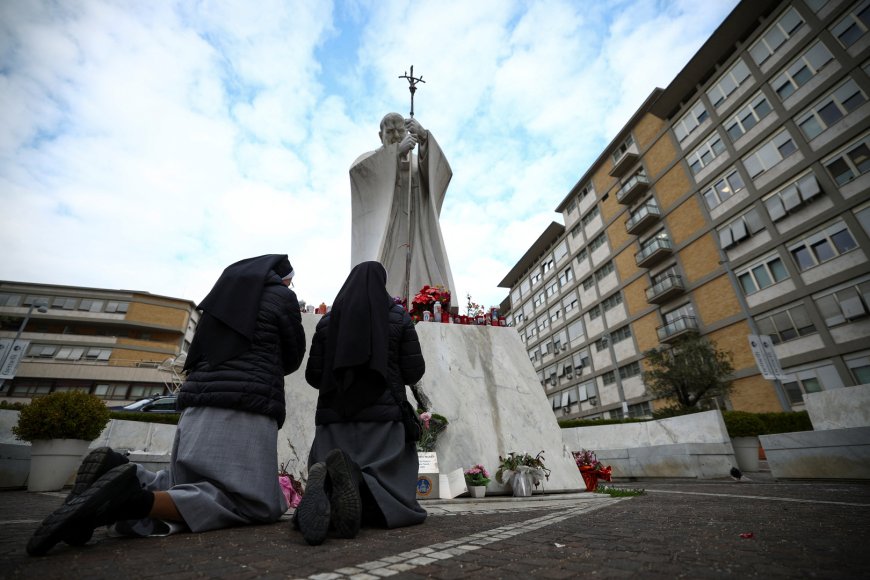 Pope’s supporters gather outside hospital over health concerns