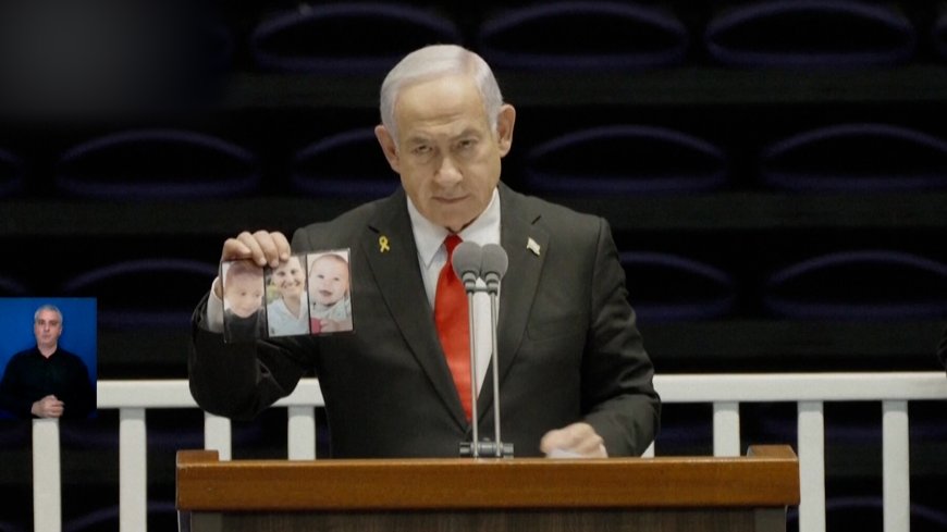 Video: Netanyahu heckled while showing photos of Bibas family